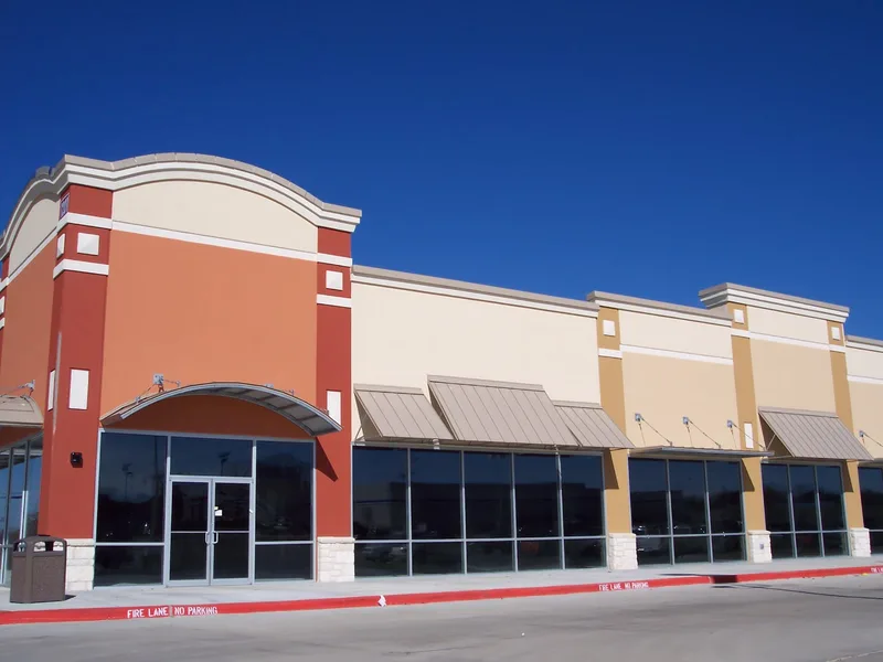 Tinted storefront glass on a commercial retail building